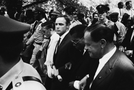 Marlon Brando, James Baldwin and Joseph Mankiewicz marching to the rally. August 28, 1963. Price on request.