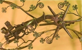 Detail of hand forged side table with Spanish spur and dogwood flowers