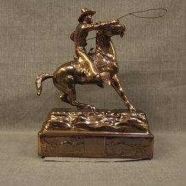 Cowboy Throwing Lariat Copper Statue, $2.500.00. This is an extremely rare copper patina statue, it is "mint condition, warehouse new," made in the 1940s by Owens Company that produced high end novelties and accessories for home and office. They produced numerous subjects, including a distinctive line of Western subjects. The Owens Company is the maker of the famous Oscars for the movie industry. I purchased the remaining warehouse inventory, which had been setting in inventory over fifty years. This is the last of a series of Western statues. I will be adding a few other different pieces over time. Inquires at Collier Gallery. Size: 13.5" High 9.5" Long 6" Wide Very Heavy